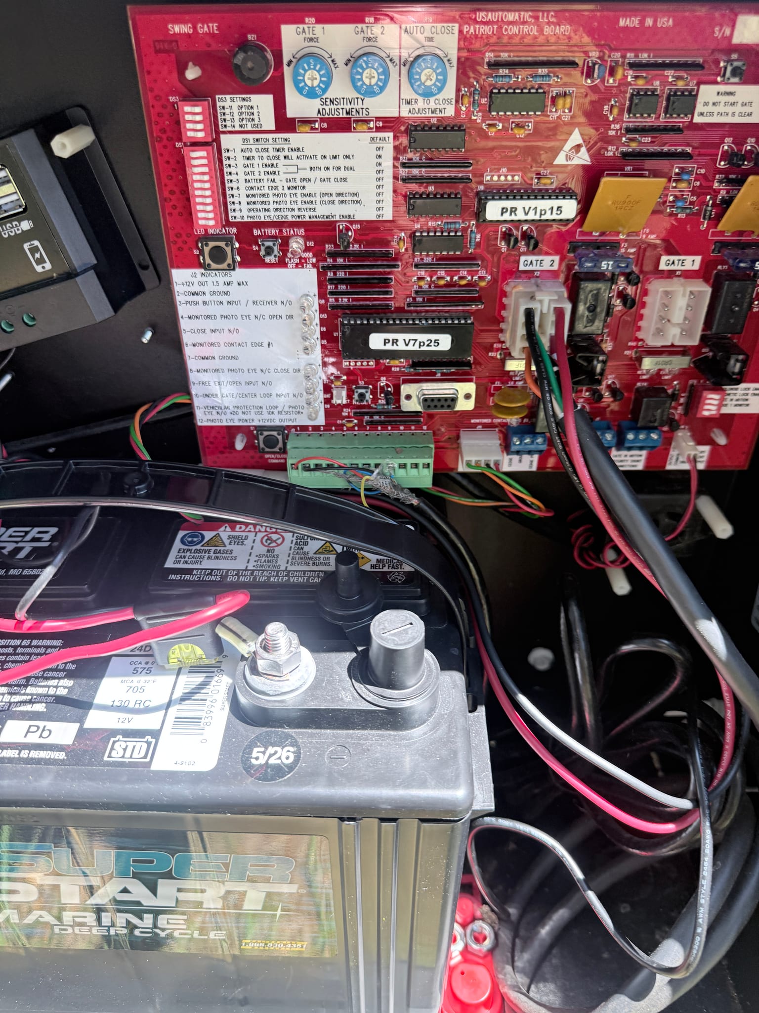 US Automatic Patriot swing gate control board wired to a deep-cycle backup battery